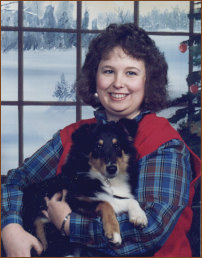 photo of Teresa Mills and Teddy Ruxpin, a black tri Shetland Sheepdog puppy