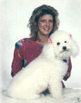 Photo of Casper, a white poodle, and his owner Temple Kite Coates