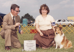Teresa Mills and Cindy winning first place at an AKC show in Charlottesville, Virginia in Novice Obedience.